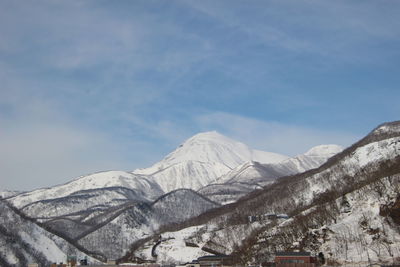 Scenic view of snowcapped mountains against sky