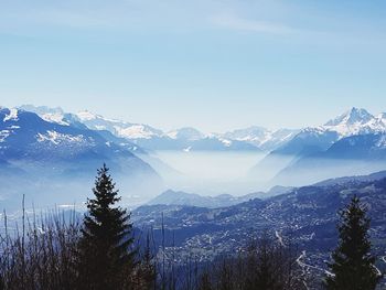 Scenic view of snowcapped mountains against sky