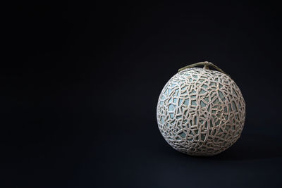 Close-up of crystal ball against black background