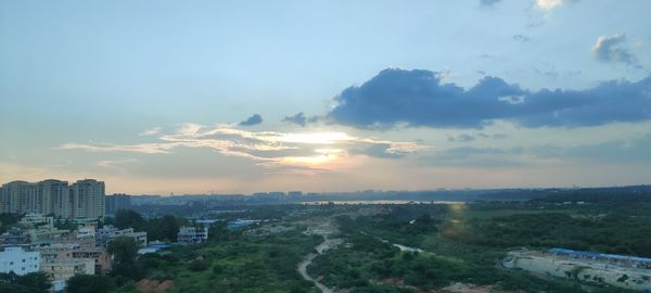 High angle view of buildings against sky during sunset