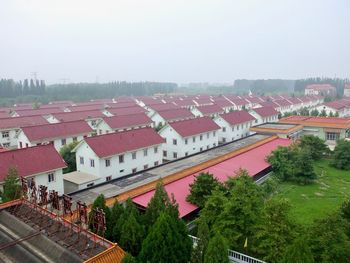 High angle view of buildings against clear sky