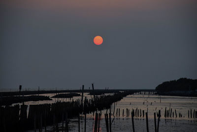 Scenic view of sea against clear sky at night