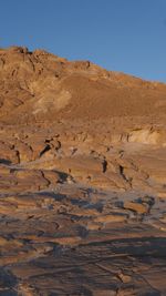 Scenic view of desert against clear sky, vertical 