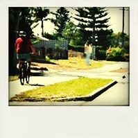 transfer print, lifestyles, auto post production filter, men, full length, bicycle, leisure activity, street, walking, motion, transportation, blurred motion, road, riding, rear view, on the move, tree, cycling
