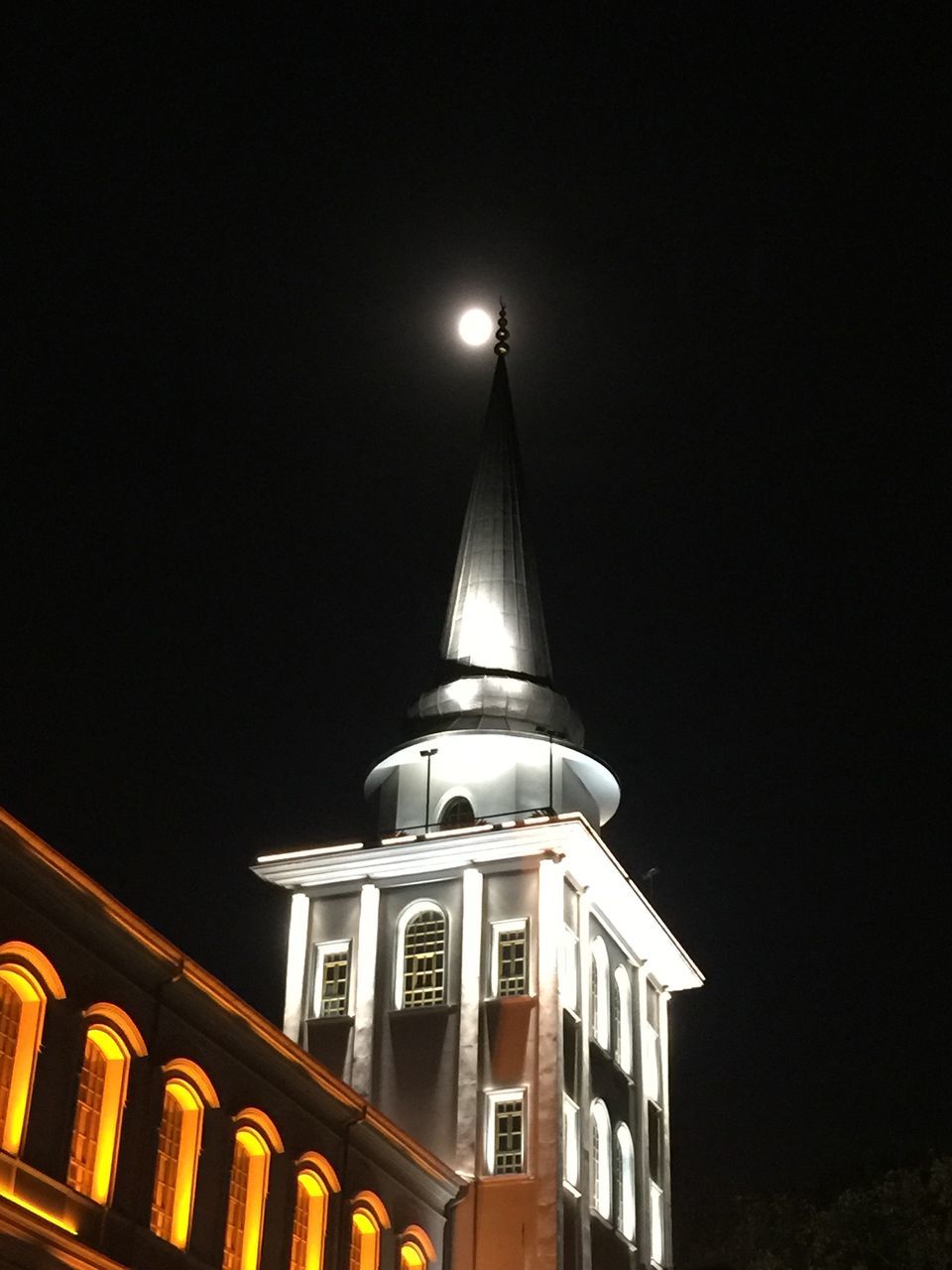 architecture, built structure, building exterior, illuminated, copy space, night, low angle view, clear sky, lighting equipment, city, building, sky, residential building, street light, residential structure, outdoors, transportation, no people, window, dusk