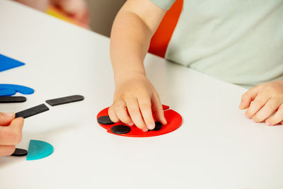 Midsection of woman working on table