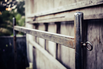 Close-up of metal railing on footpath