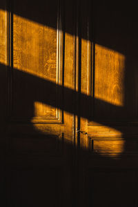 Full frame shot of wooden door in bright room