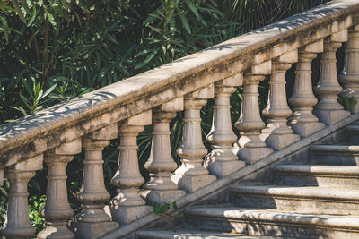 Architectural column of railing against stone wall