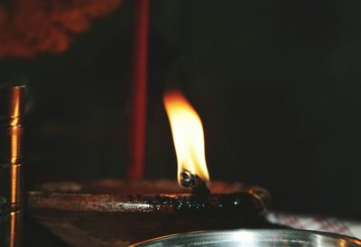 Close-up of illuminated candle