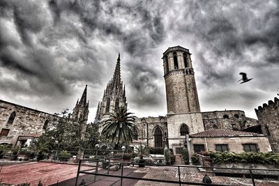 Low angle view of buildings against sky in city