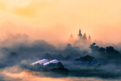 Silhouette of temple against sky during sunset