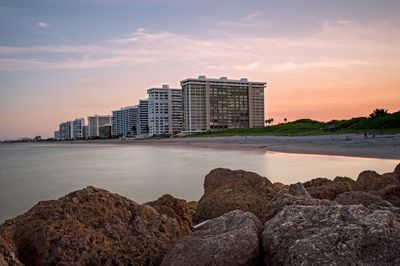 River with buildings against the sky in background