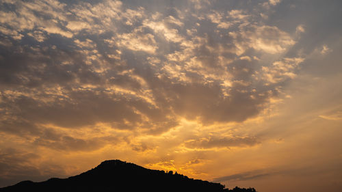 Low angle view of dramatic sky during sunset