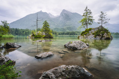 Scenic view of lake and mountains against sky