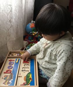 Girl playing toy at home