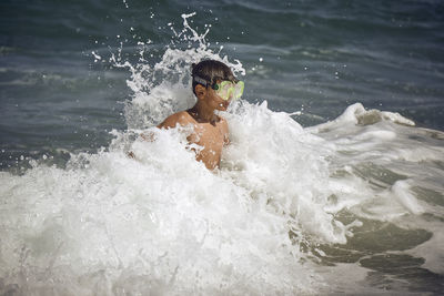 Man swimming in sea