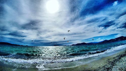 View of beach against cloudy sky