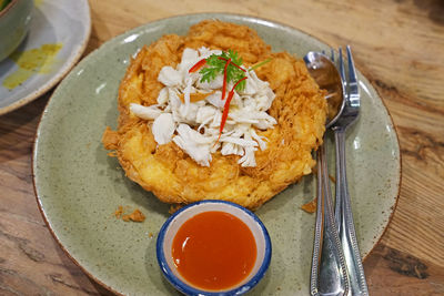 Close up deep fried omelet with crab meat