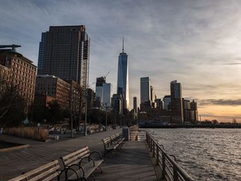 View of skyscrapers against cloudy sky