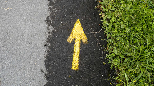 Close-up high angle view of yellow road