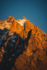 Low angle view of rock formations against sky