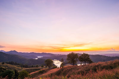 Scenic view of landscape against sky during sunset