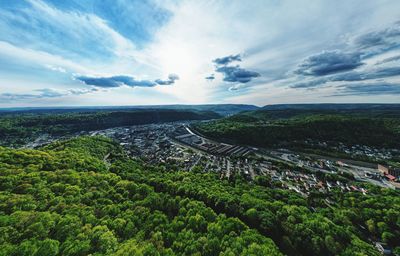 High angle view of trees and buildings against sky