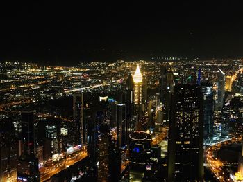 High angle view of illuminated city buildings at night