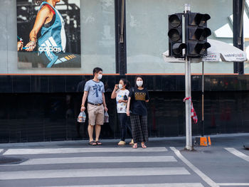 People walking on street in city