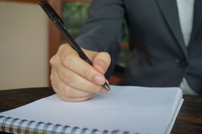 Close-up of man working on table