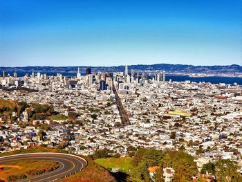 High angle view of townscape against clear blue sky