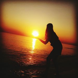 Scenic view of sea at sunset