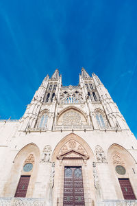 Low angle view of building against blue sky