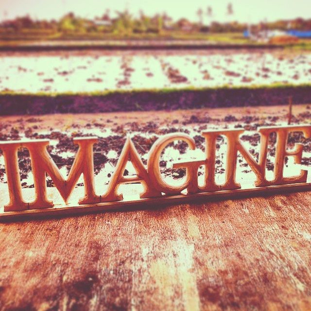 text, western script, communication, focus on foreground, metal, close-up, selective focus, rusty, capital letter, metallic, no people, outdoors, wood - material, non-western script, day, wall - building feature, sign, wooden, information, textured