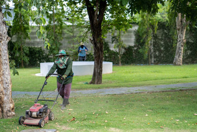 Man mowing at field 