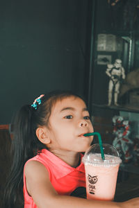 Girl drinking coffee in cafe