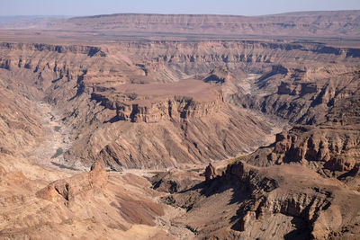 High angle view of desert against mountain range, fish river canyon. namibia