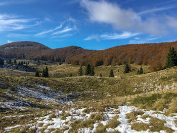 Mountain hiking trail with snow against blue sky in velebit mountain, croatia