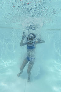 Kid swimming in pool