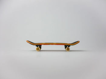 High angle view of skateboard against white background