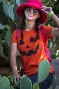 Portrait of smiling woman standing outdoors