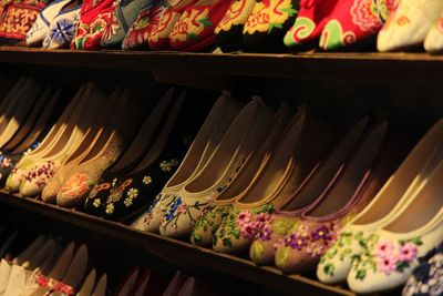 Close-up of multi colored clothes hanging on shelf