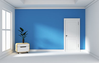 Potted plant against wall at home