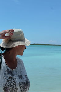 Full length of child on beach against sky