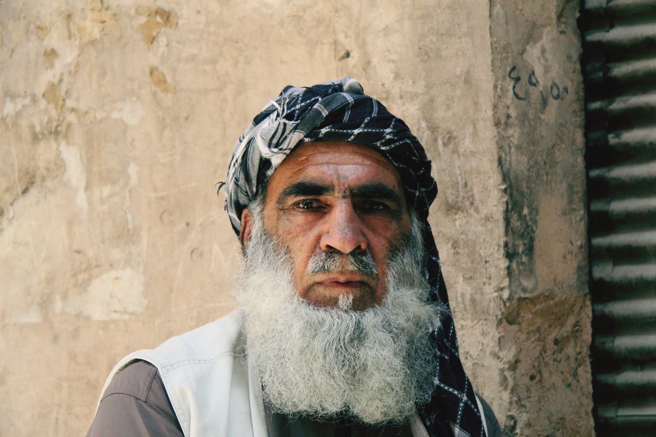 portrait, looking at camera, front view, young adult, lifestyles, headshot, young men, person, leisure activity, mid adult men, beard, casual clothing, close-up, standing, wall - building feature, mature adult, mid adult, mature men