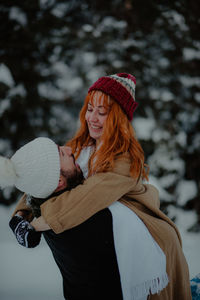 Rear view of woman wearing hat during winter