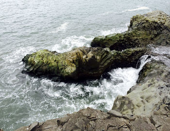 High angle view of rocks in sea