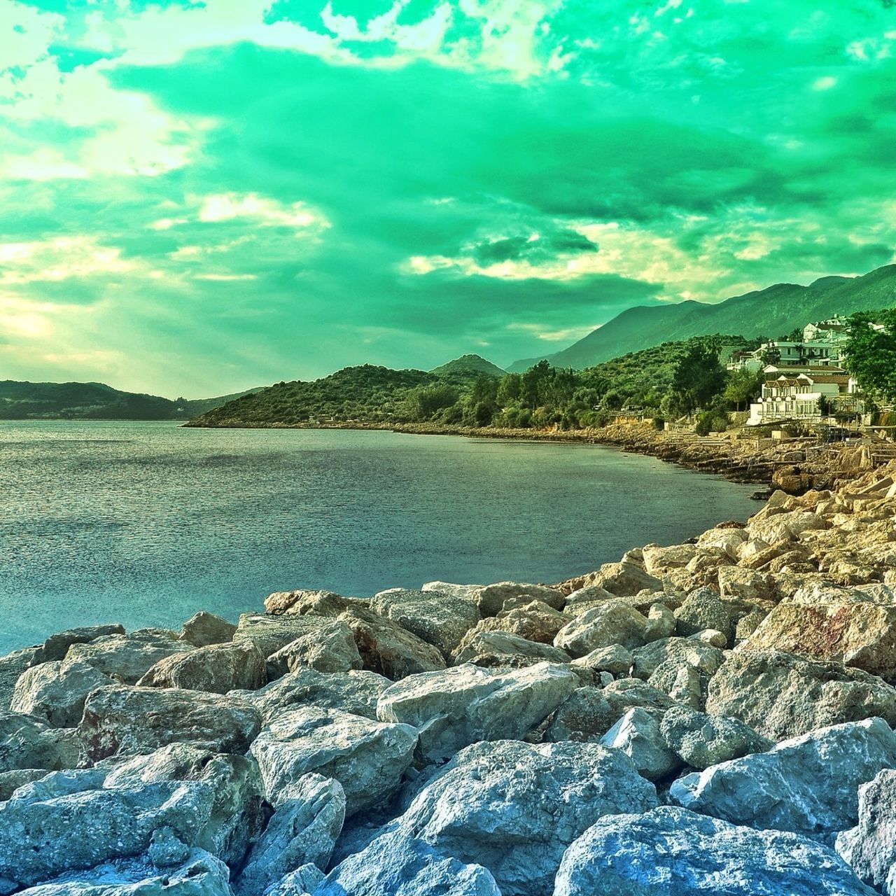 water, sky, blue, scenics, mountain, cloud - sky, beauty in nature, tranquil scene, sea, tranquility, nature, rock - object, cloud, lake, idyllic, mountain range, outdoors, cloudy, built structure, day