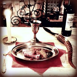 Close-up of wine glasses on table